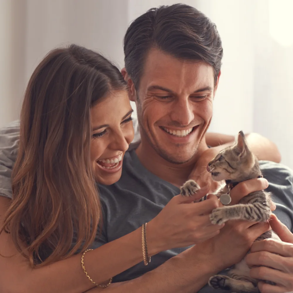couple holding a kitten