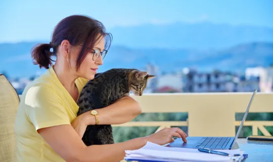 Australian lady working outdoors with her cat